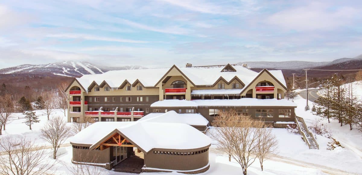 Killington Mountain Lodge - Winter Daytime Aerial View with Mountains