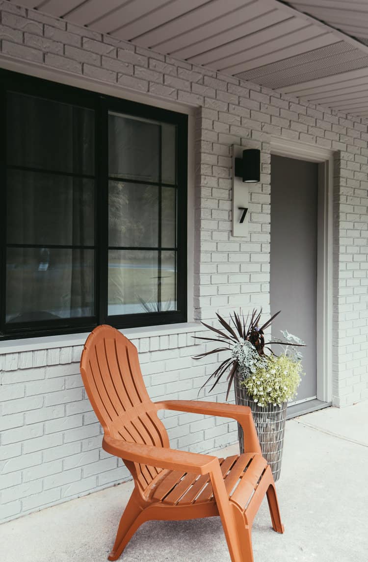 Rest a Modern Motel - Motel Room Entrance with Chair