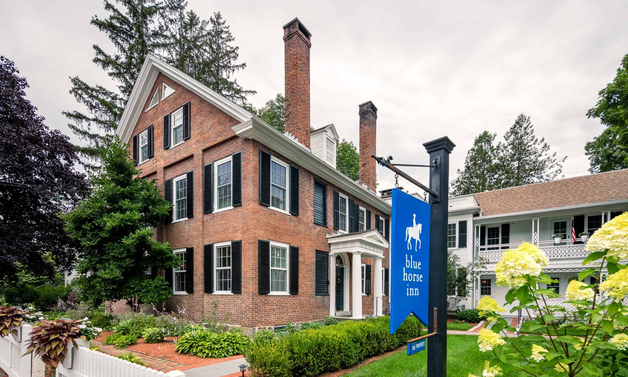 Blue Horse Inn - Summer Exterior Entrance with Sign