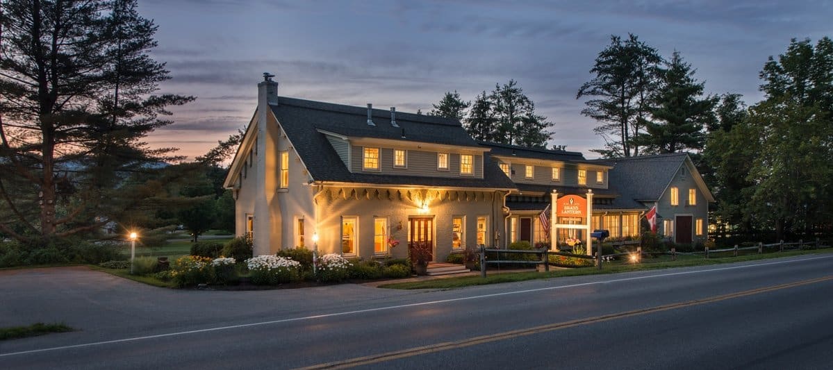 Brass Lantern Inn - Summer Exterior with Sign at Night