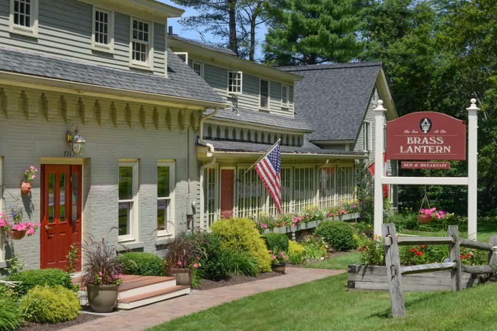 Brass Lantern Inn - Summer Exterior with Sign