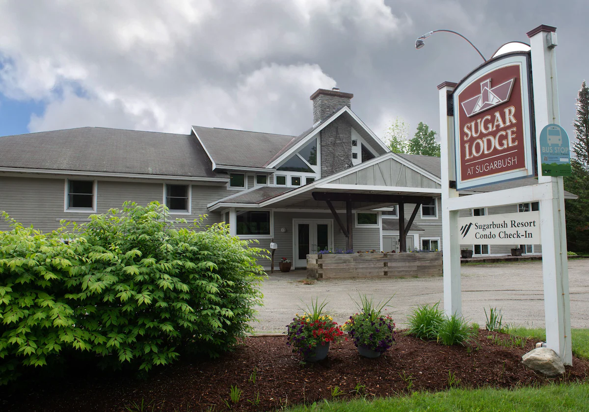 Sugar Lodge at Sugarbush - Summer Exterior Entrance with Sign