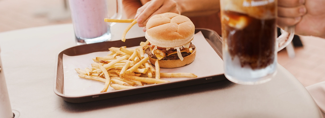 A&W Middlebury - Burger & Fries on Tray behind Root Beer Mug