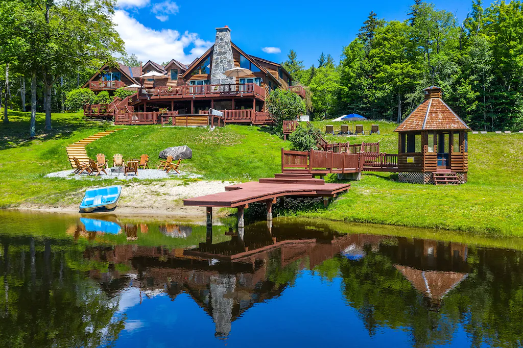 Beautiful Lakeview Log Cabin on 60-Acre Property Exterior Pond View