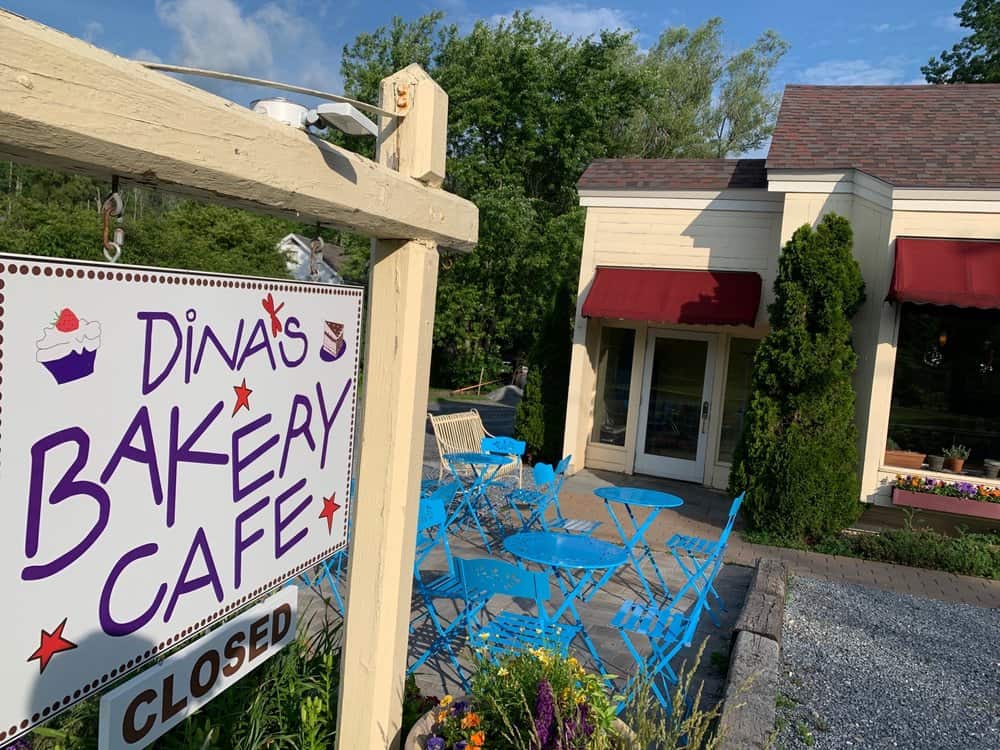 Dina's Bakery Cafe - Outdoor Tables with Sign