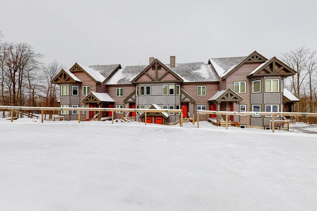 Dual-condo ski-in getaway with mountain views, fireplace Exterior Snowy