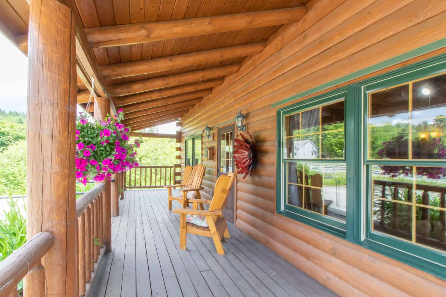 Century 21 Farm & Forest Realty - Log Cabin Porch with Chairs